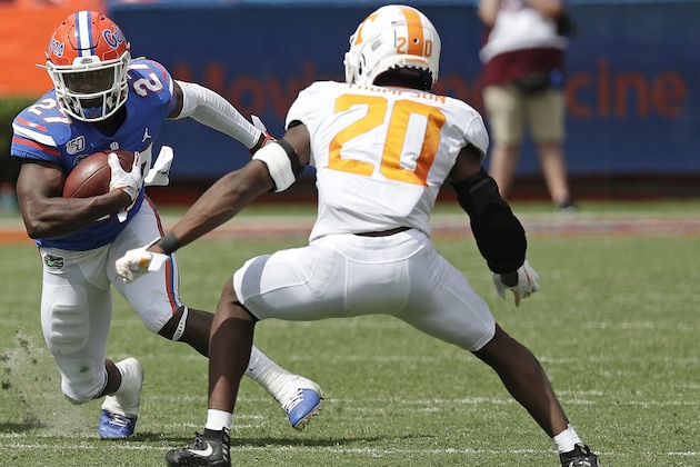 Florida running back Dameon Pierce (27) looks for room to get around Tennessee defensive back Bryce Thompson (20) during the second half of an NCAA college football game, Saturday, Sept. 21, 2019, in Gainesville, Fla. (AP Photo/John Raoux)