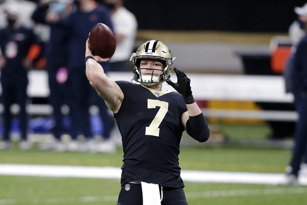 New Orleans Saints quarterback Taysom Hill (7) warms up before an NFL wild-card playoff football game against the Chicago Bears in New Orleans, Sunday, Jan. 10, 2021. (AP Photo/Butch Dill)