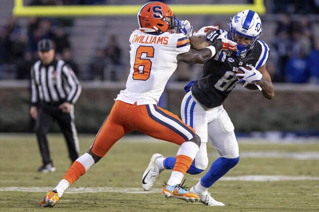 Duke's Aaron Young (81) carries the ball as Syracuse's Trill Williams (6) attempts a tackle during an NCAA college football game in Durham, N.C., Saturday, Nov. 16, 2019. (AP Photo/Ben McKeown)