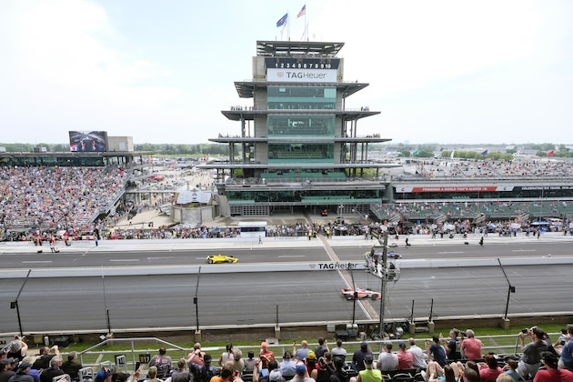 FILE - In this May 24, 2019, file photo, cars take to the track during the final practice session for the Indianapolis 500 IndyCar auto race at Indianapolis Motor Speedway in Indianapolis. The Indianapolis 500 scheduled for May 24 has been postponed until August because of the coronavirus pandemic and won't run on Memorial Day weekend for the first time since 1946.  The race will instead be held Aug. 23. (AP Photo/AJ Mast, File)