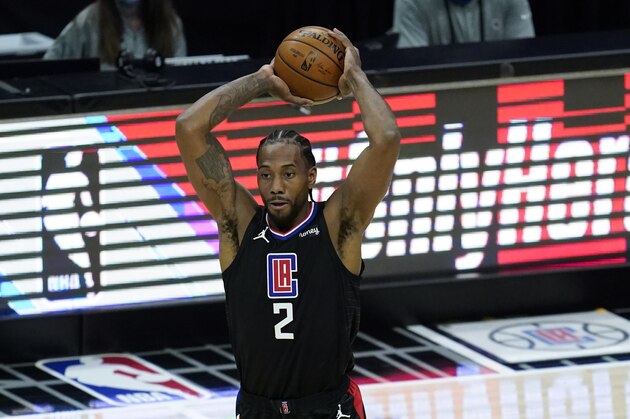 Los Angeles Clippers forward Kawhi Leonard (2) passes the ball during an NBA basketball game against the Denver Nuggets Thursday, April 1, 2021, in Los Angeles. (AP Photo/Ashley Landis)