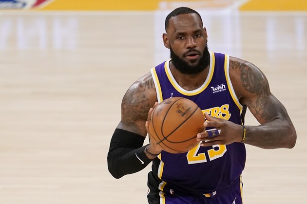 Los Angeles Lakers forward LeBron James dribbles during an NBA basketball game against the Charlotte Hornets Thursday, March 18, 2021, in Los Angeles. (AP Photo/Marcio Jose Sanchez)