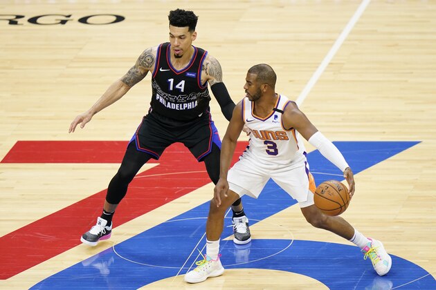 Phoenix Suns' Chris Paul, right, tries to dribble past Philadelphia 76ers' Danny Green during the first half of an NBA basketball game, Wednesday, April 21, 2021, in Philadelphia. (AP Photo/Matt Slocum)