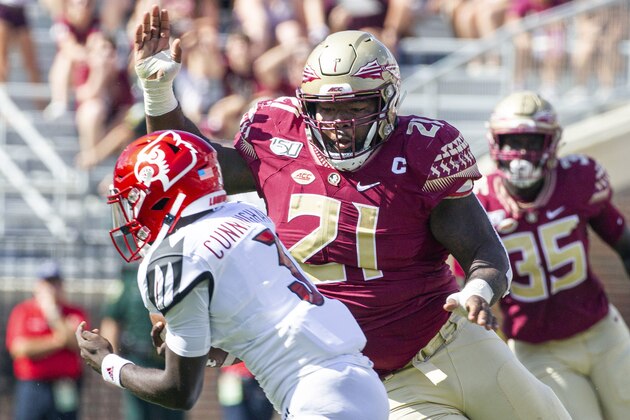 Florida State defensive tackle Marvin Wilson (21) moves in for the sack of Louisville quarterback Malik Cunningham (3) in the first half of an NCAA college football game in Tallahassee, Fla., Saturday, Sept. 21, 2019. (AP Photo/Mark Wallheiser)