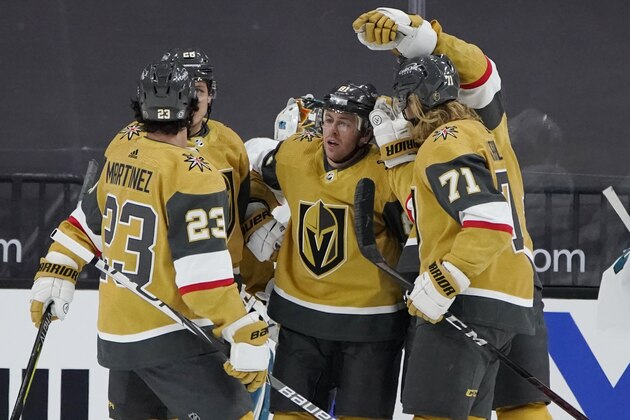 Vegas Golden Knights center Jonathan Marchessault, center, celebrates after scoring against the San Jose Sharks during the first period of an NHL hockey game Wednesday, April 21, 2021, in Las Vegas. (AP Photo/John Locher)
