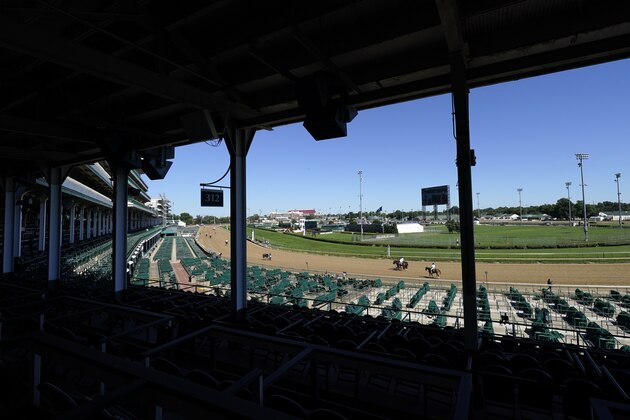 Horses are walked off the track after running in the ninth race before the 146th running of the Kentucky Derby at Churchill Downs, Saturday, Sept. 5, 2020, in Louisville, Ky. (AP Photo/Charlie Riedel)