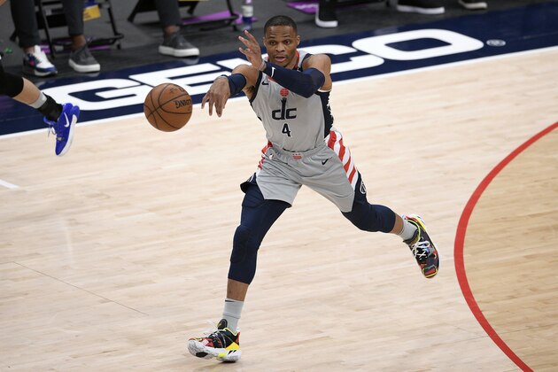 Washington Wizards guard Russell Westbrook (4) passes during the first half of an NBA basketball game against the Golden State Warriors, Wednesday, April 21, 2021, in Washington. (AP Photo/Nick Wass)