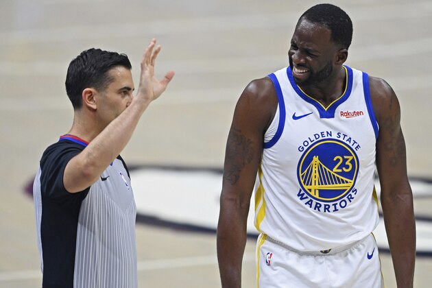 Golden State Warriors' Draymond Green (23) questions a foul call duirng the first half of the team's NBA basketball game against the Cleveland Cavaliers, Thursday, April 15, 2021, in Cleveland. (AP Photo/David Dermer)