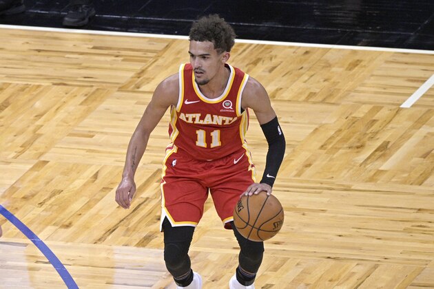 Atlanta Hawks guard Trae Young (11) sets up a play during the second half of an NBA basketball game against the Orlando Magic, Wednesday, March 3, 2021, in Orlando, Fla. (AP Photo/Phelan M. Ebenhack)