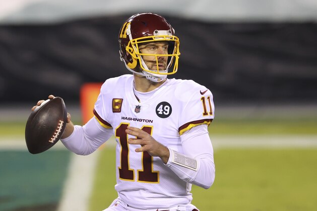 FILE - Washington Football Team quarterback Alex Smith (11) is shown in action against the Philadelphia Eagles during an NFL football game in Philadelphia, in this Sunday, Jan. 3, 2021, file photo. Smith announced his retirement Monday, April 19, 2021, on Instagram, saying he still has plenty of snaps left him just shy of his 37th birthday but is calling it quits to enjoy time with his family. (AP Photo/Rich Schultz, FIle)