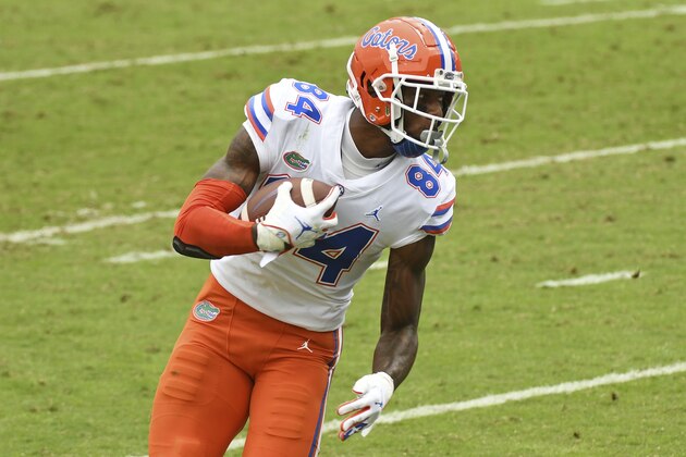 Florida tight end Kyle Pitts (84) carries the ball after a catch during the first half of an NCAA college football game against Mississippi in Oxford, Miss., Saturday, Sept. 26, 2020. (AP Photo/Thomas Graning)