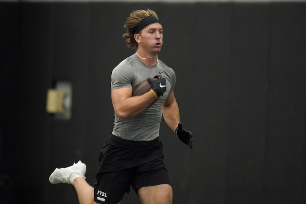 Central Missouri's Zach Davidson runs with the ball as he participates in the school's pro day football workout for NFL scouts Monday, March 22, 2021, in Columbia, Mo. (AP Photo/Jeff Roberson) Central Missouri's Zach Davidson runs with the ball as he participates in the school's pro day football workout for NFL scouts Monday, March 22, 2021, in Columbia, Mo. (AP Photo/Jeff Roberson)