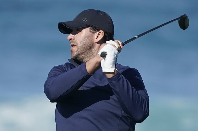 Tony Romo follows his shot from the 13th tee of the Monterey Peninsula County Club Shore Course during the second round of the AT&T Pebble Beach National Pro-Am golf tournament Friday, Feb. 7, 2020, in Pebble Beach, Calif. (AP Photo/Tony Avelar)