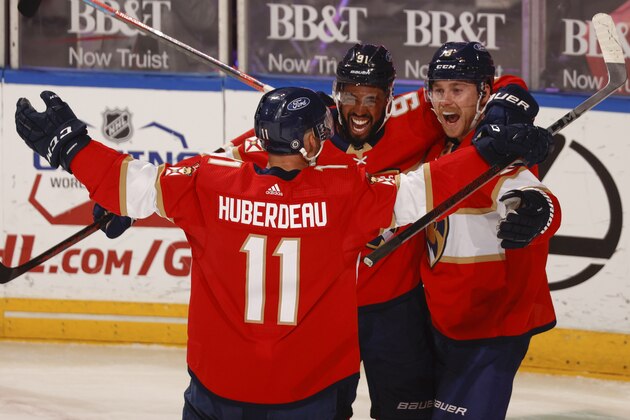 Florida Panthers center Sam Bennett (9) celebrates his goal with center Jonathan Huberdeau (11) and left wing Anthony Duclair (91) during the second period of an NHL hockey game against the Columbus Blue Jackets, Tuesday, April 20, 2021, in Sunrise, Fla. (AP Photo/Joel Auerbach)