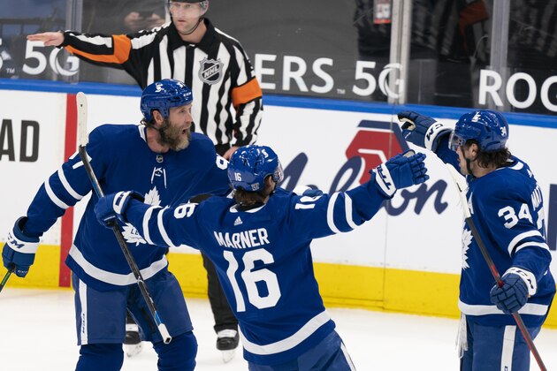 The Toronto Maple Leafs celebrate their first goal by Toronto Maple Leafs center Auston Matthews(34) during an NHL hockey game against the Ottawa Senators, Monday, Feb. 15, 2021, in Toronto, Canada. (AP Photo/Peter Power)