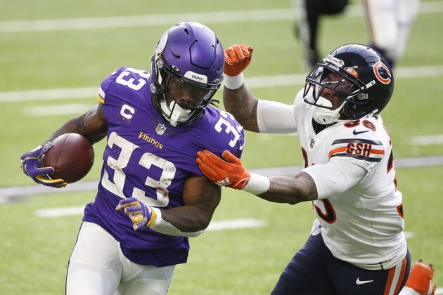 Minnesota Vikings running back Dalvin Cook (33) runs from Chicago Bears safety Eddie Jackson (39) during the first half of an NFL football game, Sunday, Dec. 20, 2020, in Minneapolis. (AP Photo/Bruce Kluckhohn)