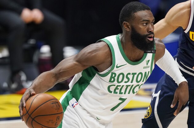 Boston Celtics guard Jaylen Brown (7) in the first half of an NBA basketball game Sunday, April 11, 2021, in Denver. (AP Photo/David Zalubowski)