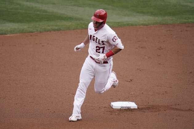 Los Angeles Angels' Mike Trout rounds the bases after hitting a home run against the Texas Rangers during the first inning of a baseball game, Wednesday, April 21, 2021, in Anaheim, Calif. (AP Photo/Jae C. Hong)
