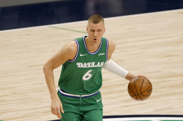 Dallas Mavericks center Kristaps Porzingis (6) handles the ball against the New York Knicks during the first half of an NBA basketball game, Friday, April 16, 2021, in Dallas. (AP Photo/Ron Jenkins)