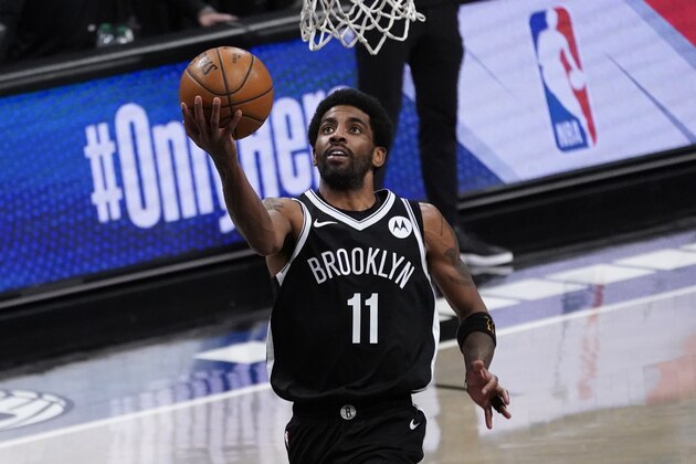 Brooklyn Nets guard Kyrie Irving goes to the basket during the second half of an NBA basketball game against the Boston Celtics, Friday, April 23, 2021, in New York. (AP Photo/Mary Altaffer)