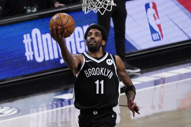 Brooklyn Nets guard Kyrie Irving goes to the basket during the second half of an NBA basketball game against the Boston Celtics, Friday, April 23, 2021, in New York. (AP Photo/Mary Altaffer)