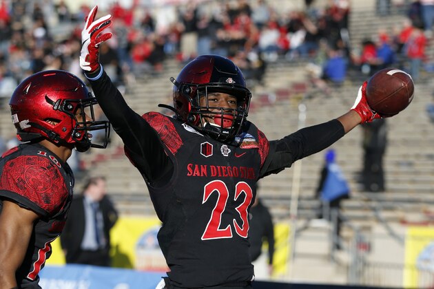 San Diego State cornerback Darren Hall (23) celebrates with teammate Luq Barcoo after scoring a touchdown on a Central Michigan fumble return during the second half of the New Mexico Bowl NCAA college football game on Saturday, Dec. 21, 2019 in Albuquerque, N.M. (AP Photo/Andres Leighton)