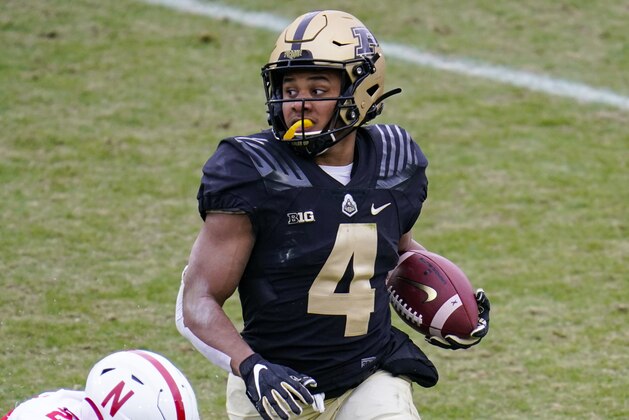 Purdue wide receiver Rondale Moore (4) runs against Nebraska during the first quarter of an NCAA college football game in West Lafayette, Ind., Saturday, Dec. 5, 2020. (AP Photo/Michael Conroy)