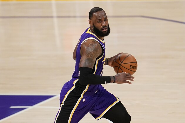 Los Angeles Lakers forward LeBron James dribbles against the Charlotte Hornets during the second half of an NBA basketball game Thursday, March 18, 2021, in Los Angeles. (AP Photo/Marcio Jose Sanchez)