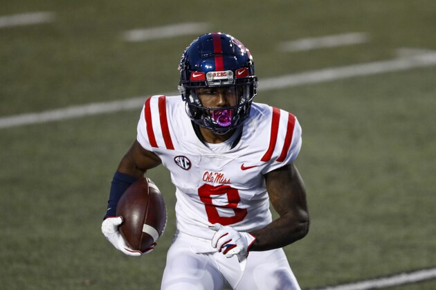 Mississippi wide receiver Elijah Moore (8) runs for yardage during their game against Vanderbilt, Saturday, Oct. 31, 2020, in Nashville, Tenn. (AP Photo/Wade Payne)