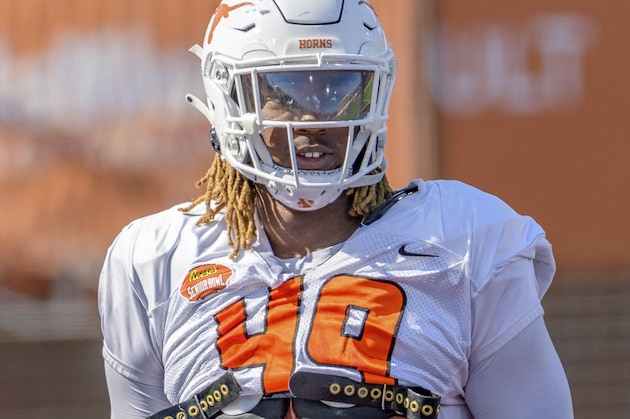 National Team defensive lineman Ta'Quon Graham of Texas (49) runs a drill during the National Team practice for the Senior Bowl college football game in Mobile, Ala., Thursday, Jan. 28, 2021. (AP Photo/Matthew Hinton)