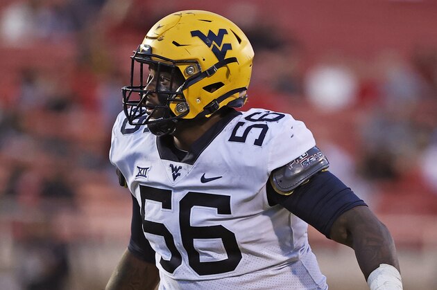 West Virginia defensive tackle Darius Stills (56) is shown during an NCAA college football game against Texas Tech, Saturday, Oct. 24, 2020, in Lubbock, Texas. Stills was selected to The Associated Press All-America first-team defense, Monday, Dec. 28, 2020. (AP Photo/Brad Tollefson)