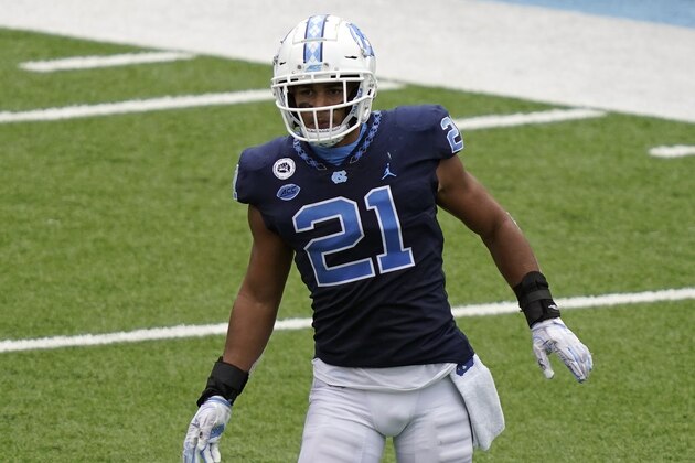 North Carolina linebacker Chazz Surratt (21) keeps an eye on the play during the second half of an NCAA college football game against Virginia Tech in Chapel Hill, N.C., Saturday, Oct. 10, 2020. (AP Photo/Gerry Broome)