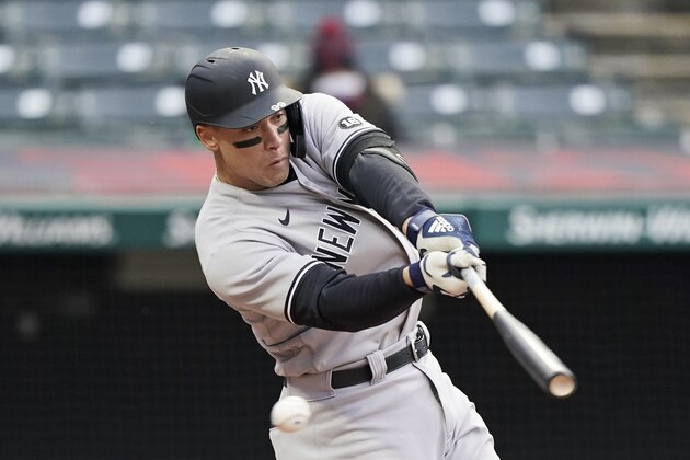 New York Yankees' Aaron Judge swings for strike three in the third inning of a baseball game against the Cleveland Indians, Thursday, April 22, 2021, in Cleveland. (AP Photo/Tony Dejak)