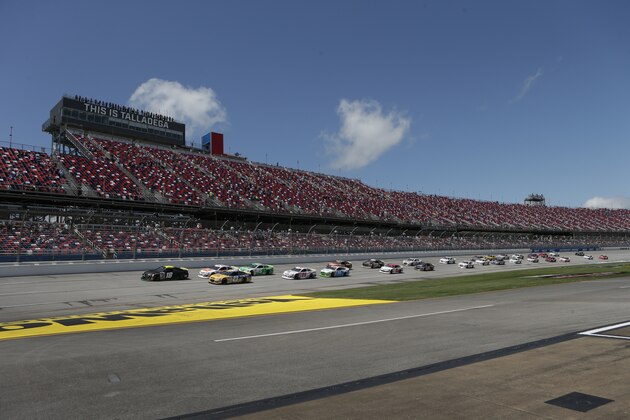 Ty Gibbs (18) leads the pack to start the General Tire 200 ARCA Series auto race at Talladega Superspeedway Saturday, April 24, 2021 in Talladega, Ala. (AP Photo/Butch Dill)