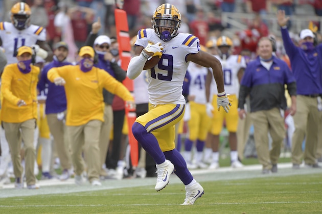 LSU defensive back Jabril Cox returns an interception against Arkansas during the first half of an NCAA college football game Saturday, Nov. 21, 2020, in Fayetteville, Ark. (AP Photo/Michael Woods)