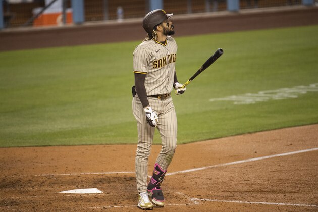 San Diego Padres' Fernando Tatis Jr. watches his solo home run during a baseball game against the Los Angeles Dodgers in Los Angeles, Saturday, April 24, 2021. (AP Photo/Kyusung Gong)