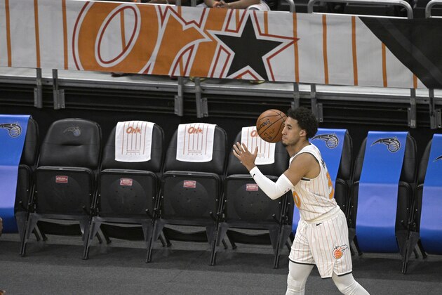 Orlando Magic guard Devin Cannady (30) looks to inbound the ball during the first half of an NBA basketball game against the New Orleans Pelicans, Thursday, April 22, 2021, in Orlando, Fla. (AP Photo/Phelan M. Ebenhack)