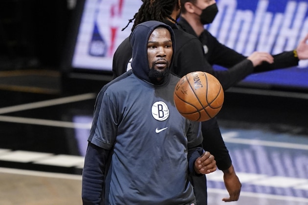 The ball is suspending in midair in front of Brooklyn Nets forward Kevin Durant before an NBA basketball game against the Phoenix Suns, Sunday, April 25, 2021, in New York. (AP Photo/Kathy Willens)