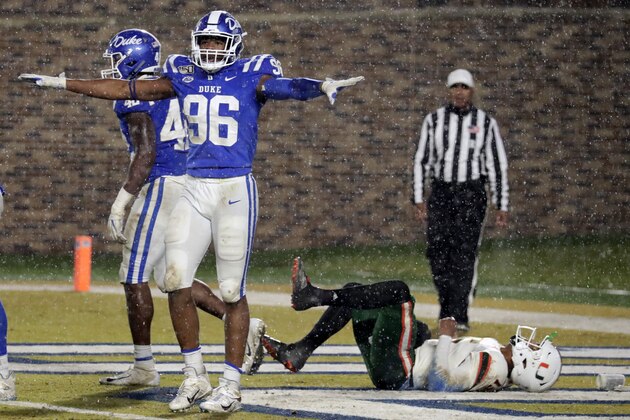 Duke's Chris Rumph II (96) celebrates in front of Miami's Jarren Williams (15) after Duke made a defensive stop during the third quarter of an NCAA college football game in Durham, N.C., Saturday, Nov. 30, 2019. (AP Photo/Chris Seward)