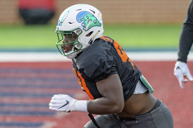 American Team defensive lineman Cameron Sample of Tulane (93) runs a drill during the American Team practice for the NCAA Senior Bowl college football game in Mobile, Ala. Wednesday, Jan. 27, 2021. (AP Photo/Matthew Hinton)