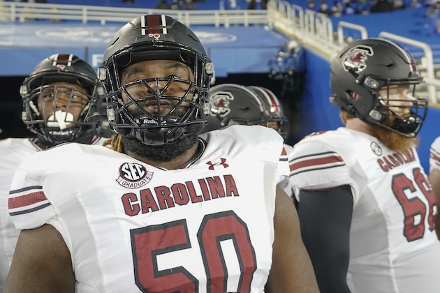 South Carolina offensive lineman Sadarius Hutcherson (50) prepare to run on before an NCAA college football game against Kentucky, Saturday, Dec. 5, 2020, in Lexington, Ky. (AP Photo/Bryan Woolston)