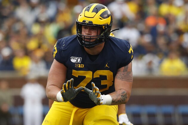 FILE - Michigan offensive lineman Jalen Mayfield (73) blocks against Rutgers in the first half of an NCAA college football game in Ann Arbor, Mich., Saturday, Sept. 28, 2019. Mayfield is entering the NFL draft. The junior announced his plans Tuesday, Aug. 18, 2020 on Twitter. Mayfield chose to leave the Wolverines one week after the Big Ten postponed its fall football season because of the coronavirus pandemic. (AP Photo/Paul Sancya)