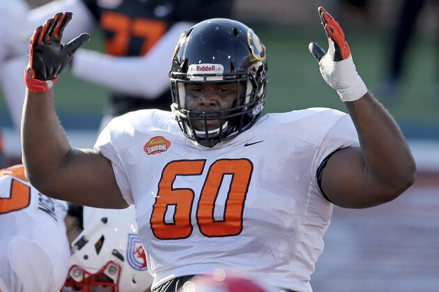 Offensive lineman David Moore of Grambling StateÂ (FCS) (60) signals a touchdown during the American team practice for the NCAA college football Senior Bowl in Mobile, Ala, Thursday, Jan. 28, 2021. (AP Photo/Rusty Costanza)