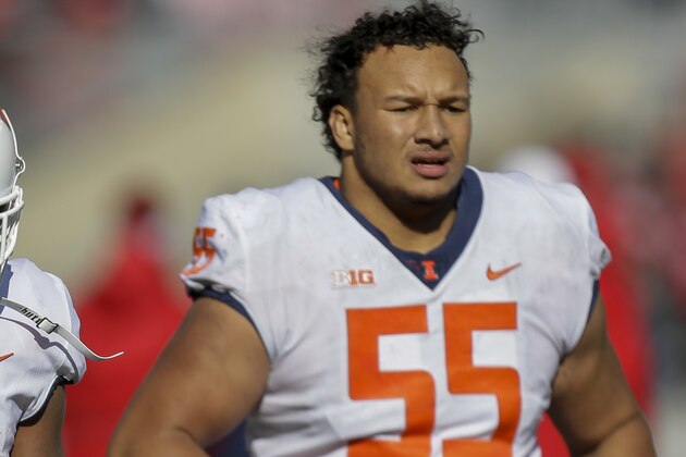 Illinois running back Reggie Corbin (2) and offensive lineman Kendrick Green walk off the field after losing 49-20 to Wisconsin in an NCAA college football game Saturday, Oct. 20, 2018, in Madison, Wis. (AP Photo/Andy Manis)