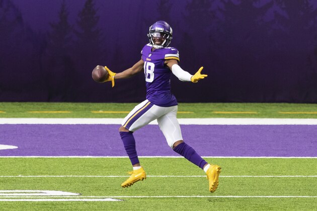 Minnesota Vikings wide receiver Justin Jefferson (18) celebrates after catching a touchdown pass in the third quarter during an NFL football game against the Tennessee Titans, Sunday, Sept. 27, 2020, in Minneapolis. The Titans defeated the Vikings 31-20. (AP Photo/David Berding)
