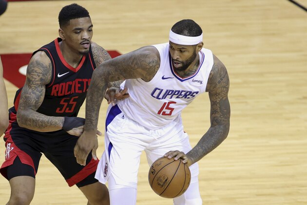 Los Angeles Clippers' DeMarcus Cousins, right, works against Houston Rockets' DaQuan Jeffries during the first quarter of an NBA basketball game Friday, April 23, 2021, in Houston. (Carmen Mandato/Pool Photo via AP)