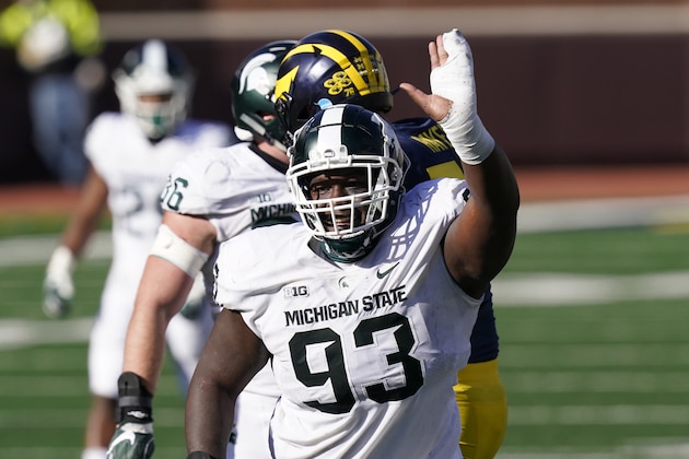 Michigan State defensive tackle Naquan Jones (93) reacts after sacking Michigan quarterback Joe Milton during the second half of an NCAA college football game, Saturday, Oct. 31, 2020, in Ann Arbor, Mich. (AP Photo/Carlos Osorio)