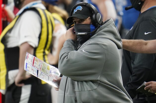 Detroit Lions head coach Matt Patricia adjusts his face mask during the second half of an NFL football game against the Houston Texans, Thursday, Nov. 26, 2020, in Detroit. (AP Photo/Paul Sancya)