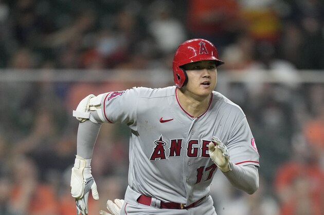 Los Angeles Angels' Shohei Ohtani, of Japan, runs down the baseline after hitting a double against the Houston Astros during the fifth inning of a baseball game Friday, April 23, 2021, in Houston. (AP Photo/David J. Phillip)