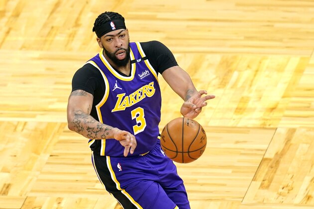 Los Angeles Lakers forward Anthony Davis (3) passes the ball during the first half of an NBA basketball game against the Orlando Magic, Monday, April 26, 2021, in Orlando, Fla. (AP Photo/John Raoux)